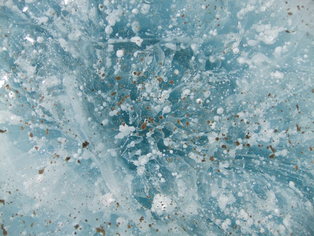 Bubbles in blue ice on the surface of a frozen lake