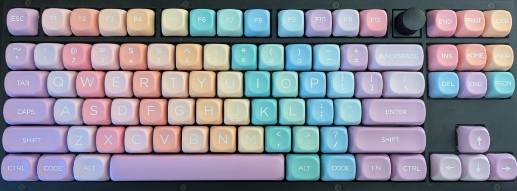 A very colorful, pastel rainbow mechanical keyboard